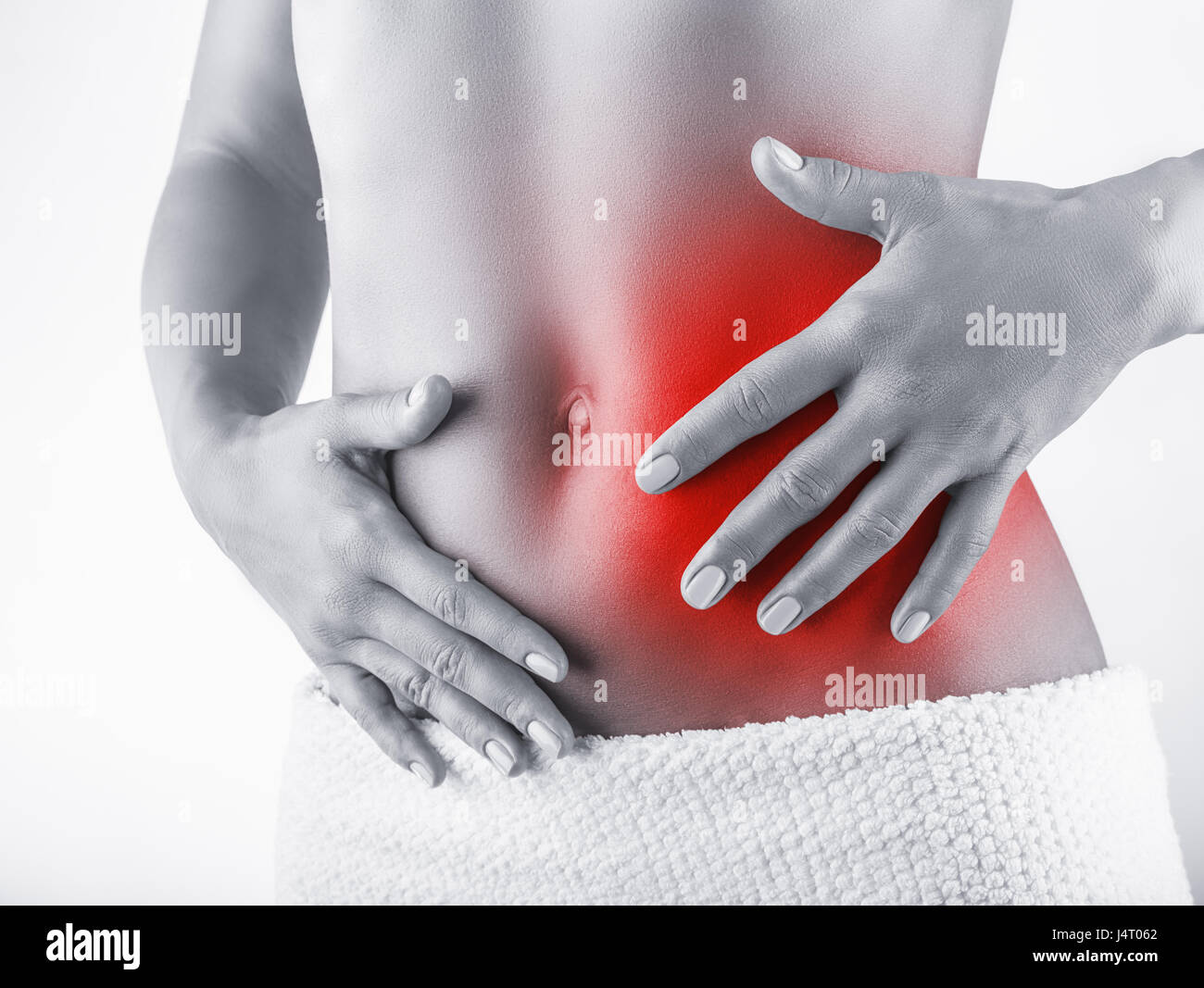 Woman with stomach pain isolated on white background Stock Photo