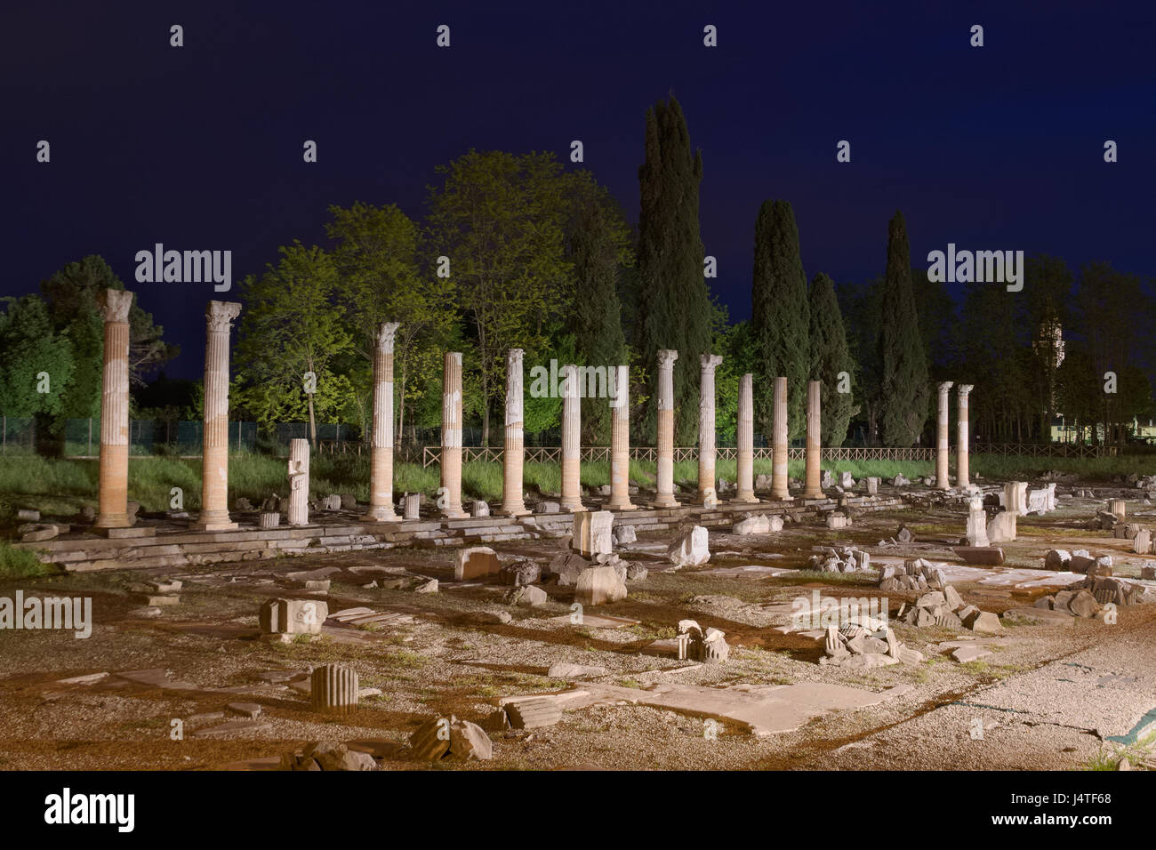 Night view of the columns of the ancient Roman Forum Ruins in Aquileia, Friuli, Italy Stock Photo