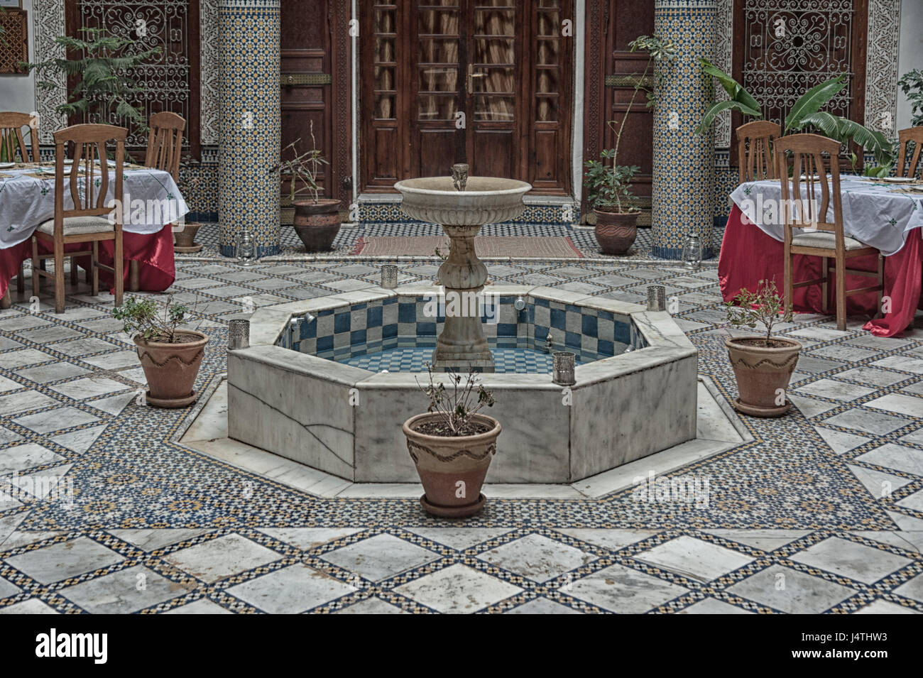 FEZ, MOROCCO - FEBRUARY 19, 2017: Interior of a small family owned hotel in the medina of Fes. The medina is listed as a UNESCO World Heritage Site Stock Photo