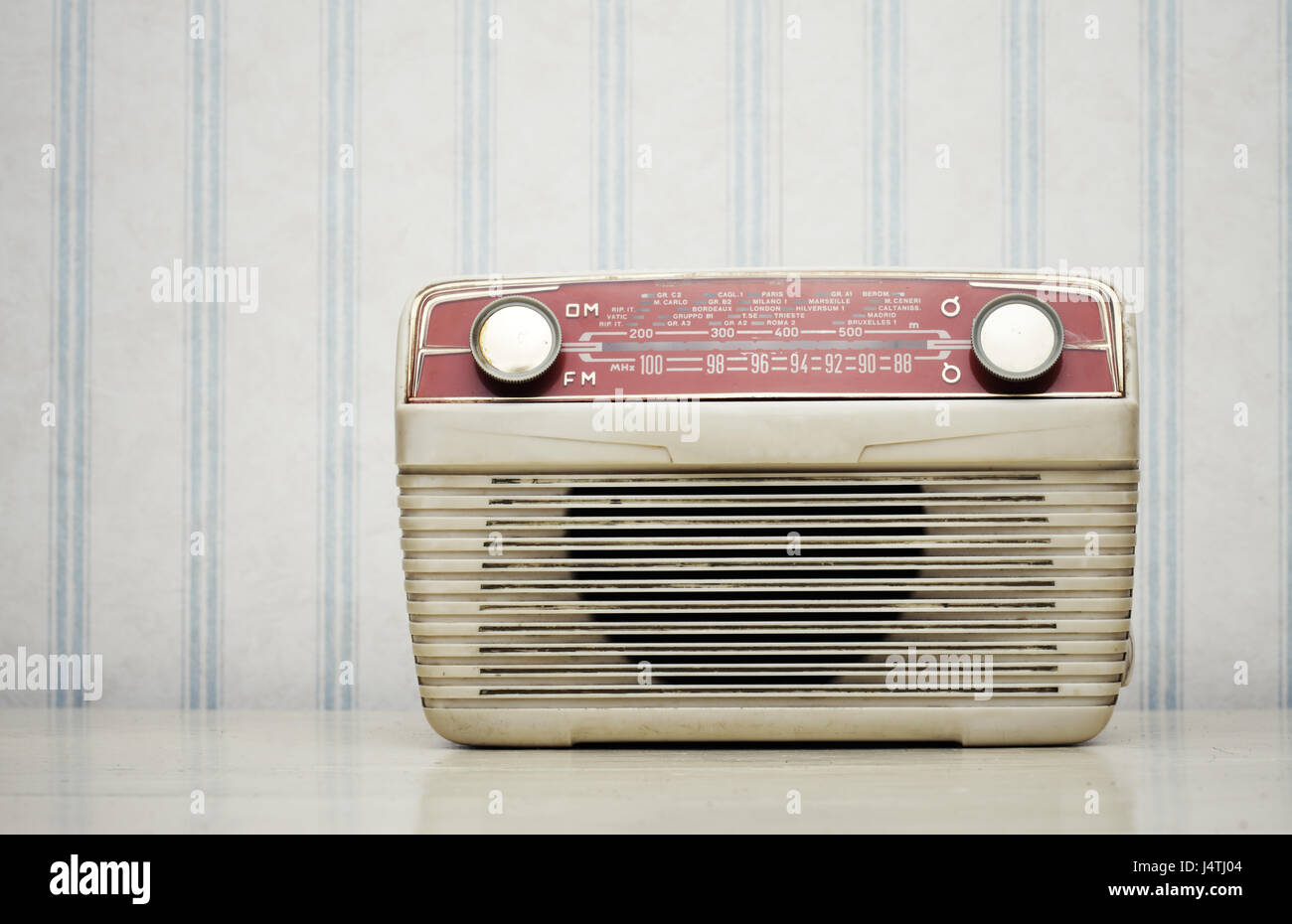 Antique radio on vintage wallpaper Stock Photo - Alamy