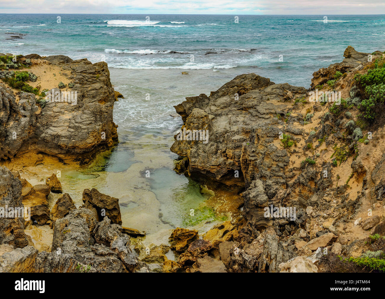 The sharp rocks on the Australian coast of the Pacific ocean Stock ...