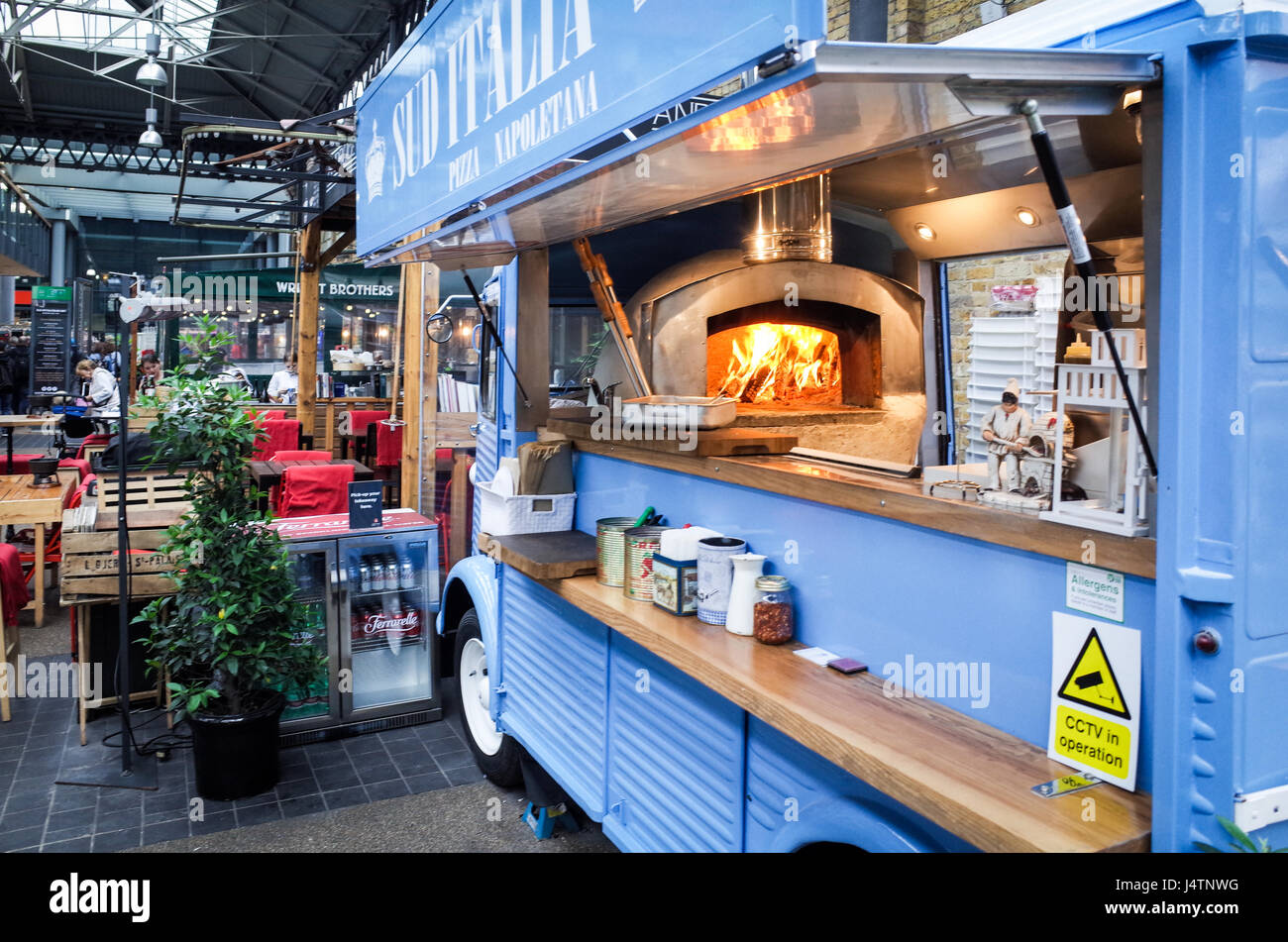 A mobile Pizza van fires up the oven in London's Spitalfields market