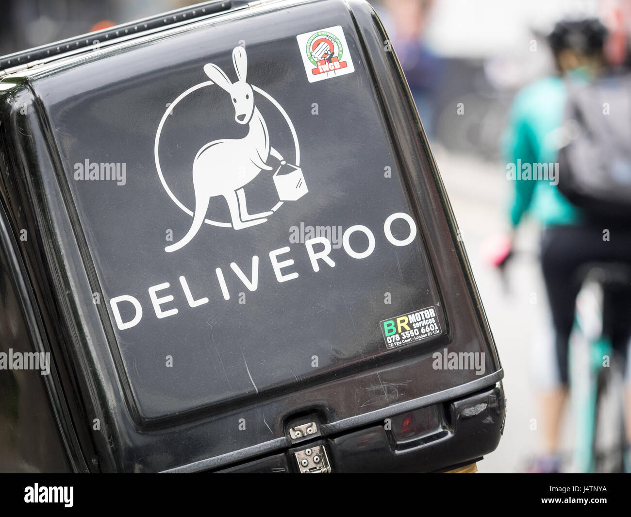 A Deliveroo food delivery box on a scooter in central London, UK. Deliveroo is competing with UberEats and smaller rivals in the lucrative trade Stock Photo