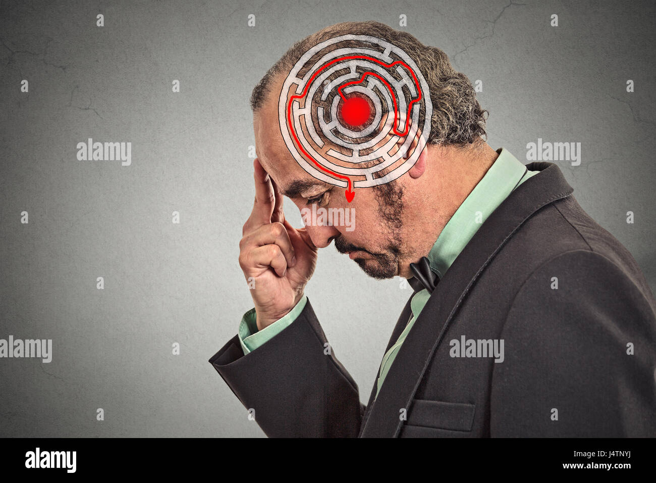 Right decision wisdom strategy concept. Side profile middle aged man solving problem isolated on gray wall background. Face expression Stock Photo