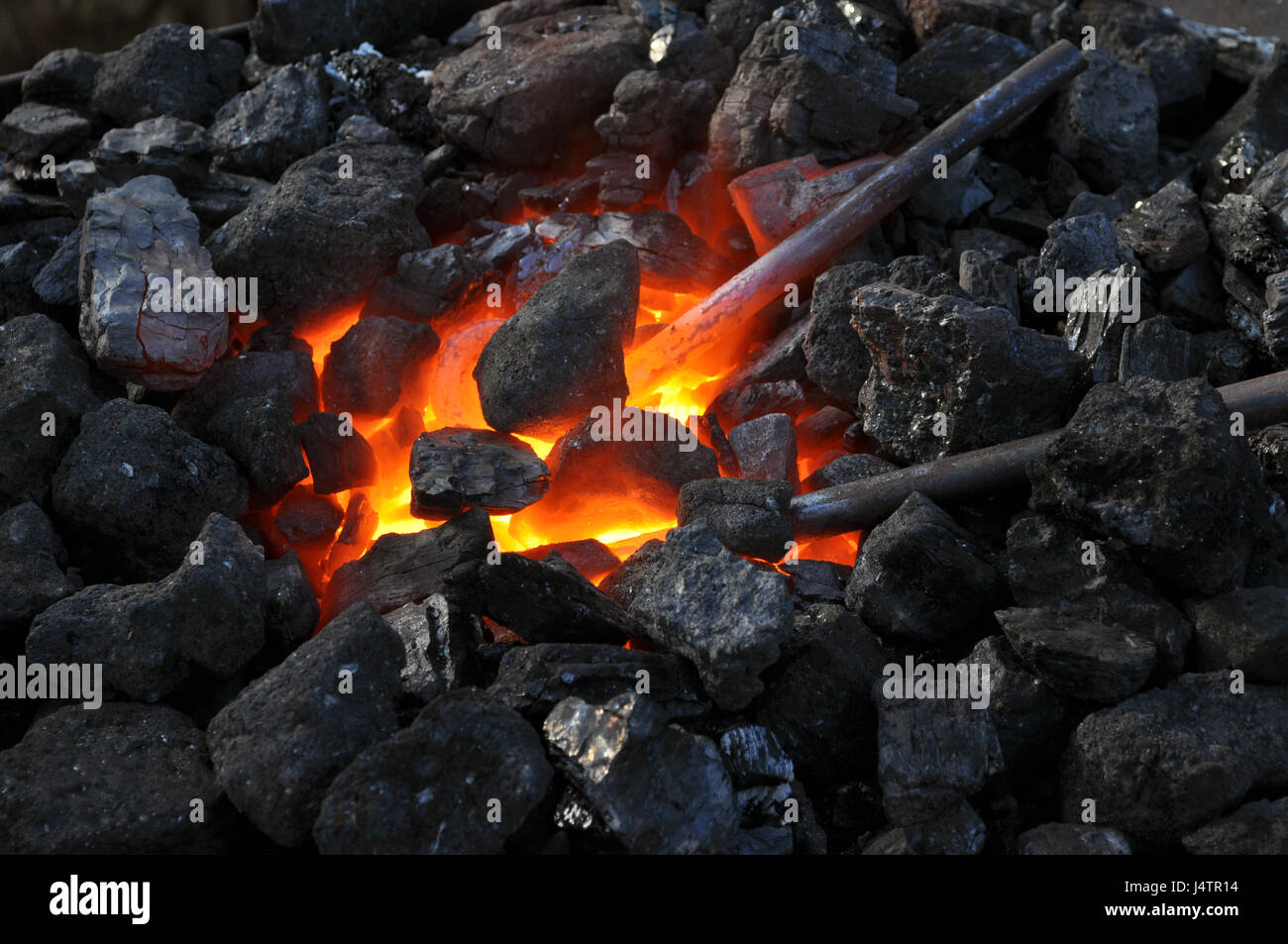 close up of a furnace metal is heated in the forge on coals with hot flaming coal Stock Photo Alamy