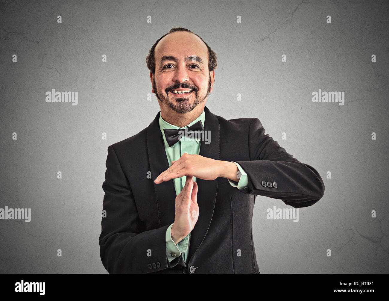 Businessman executive showing time out sign hand gesture. Human emotion, body language, reaction. Negotiation, meeting, politics concept Stock Photo
