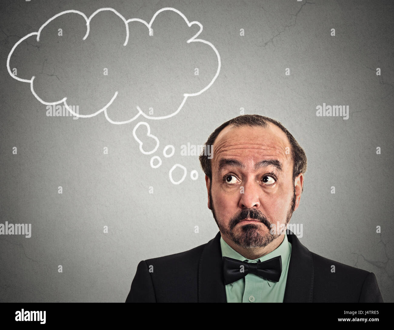 Headshot middle aged man with thoughtful puzzled face expression blank bubble with copy space