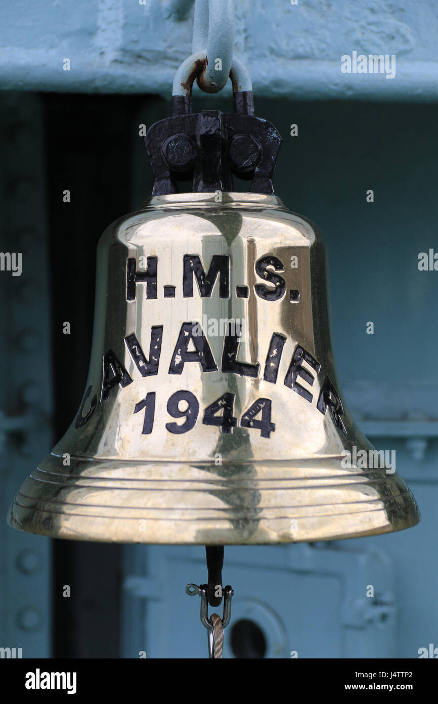 The main bell from HMS Cavalier which is a retired C-class destroyer of the Royal Navy. She was laid down by J. Samuel White and Company at East Cowes on 28 March 1943, launched on 7 April 1944,[1] and commissioned on 22 November 1944.[3] She served in World War II and in various commissions in the Far East until she was decommissioned in 1972. After decommissioning she was preserved as a museum ship and currently resides at Chatham Historic Dockyard. Stock Photo