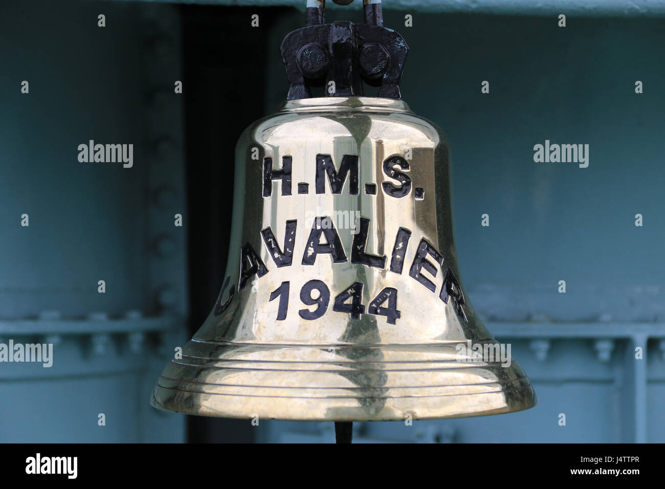 The main bell from HMS Cavalier which is a retired C-class destroyer of the Royal Navy. She was laid down by J. Samuel White and Company at East Cowes on 28 March 1943, launched on 7 April 1944,[1] and commissioned on 22 November 1944.[3] She served in World War II and in various commissions in the Far East until she was decommissioned in 1972. After decommissioning she was preserved as a museum ship and currently resides at Chatham Historic Dockyard. Stock Photo
