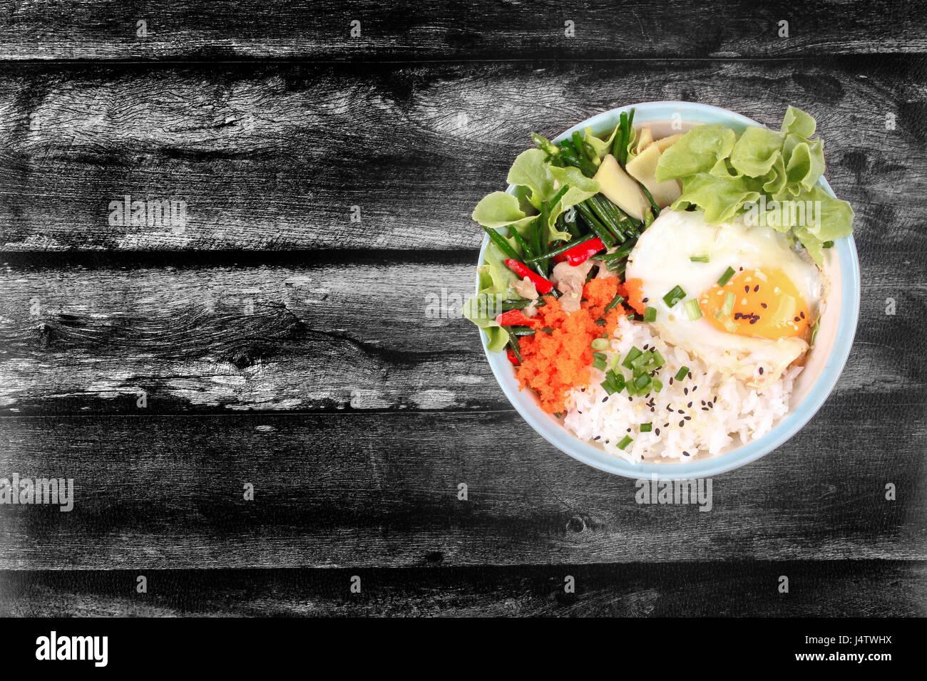 Thai jasmine rice in Japanese style,Rice is topped soft boil eggs and fried chicken with garlic