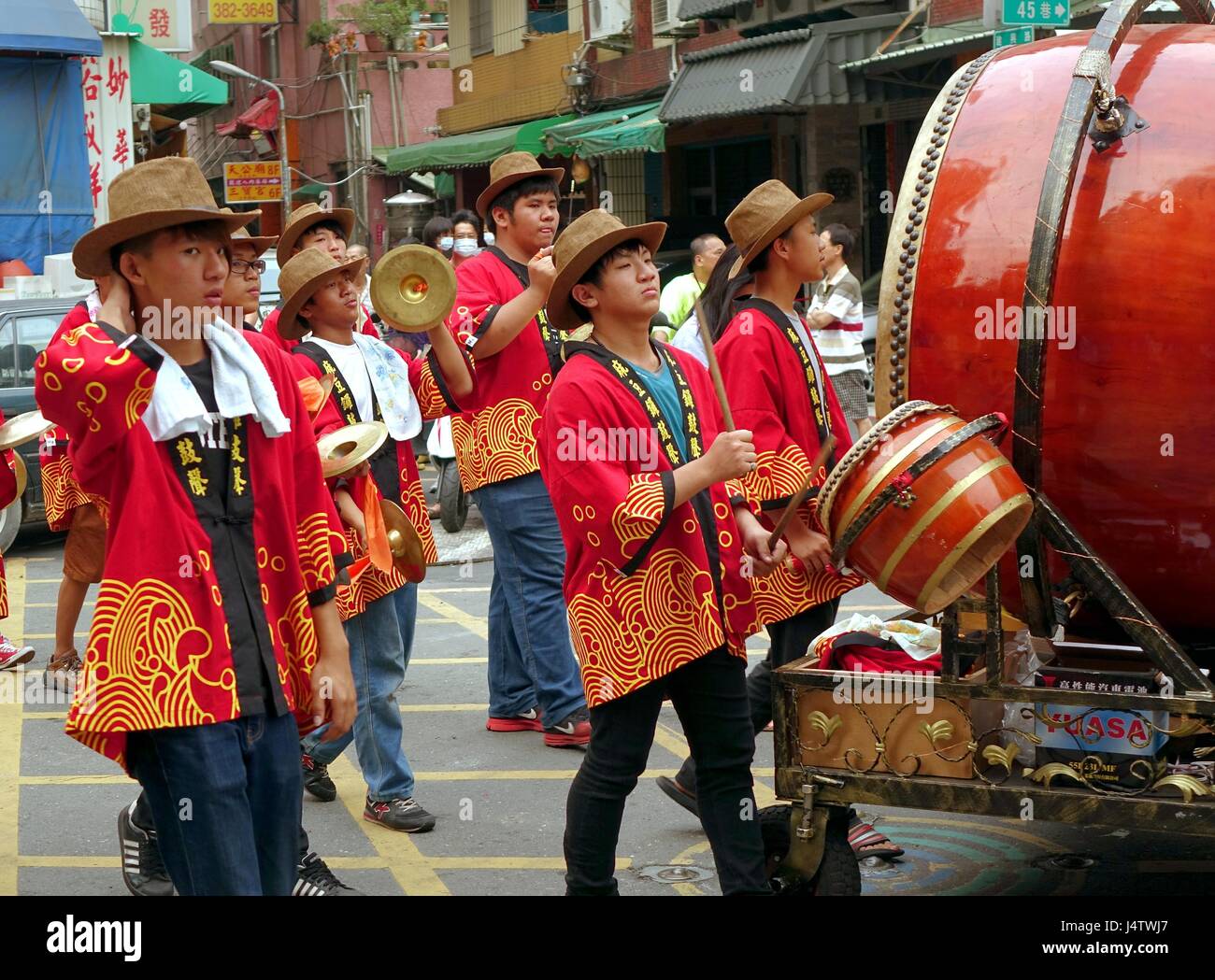 KAOHSIUNG, TAIWAN APRIL 20, 2014 Young men in indentical hats and