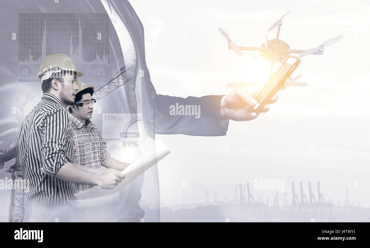 Smart construction , augmented reality in industry 4.0 concept. Double exposure of Business hand suit using mobile phone and two engineers using ar gl Stock Photo