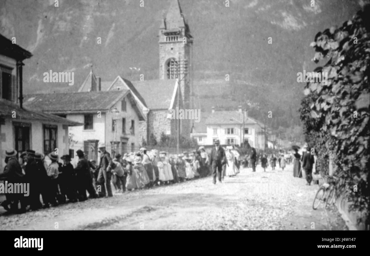 This image from 1905 shows Bahnhofstrasse in Walenstadt, Switzerland, featuring the Glockenaufzug, a clock tower known for its historical significance and architectural style. Stock Photo