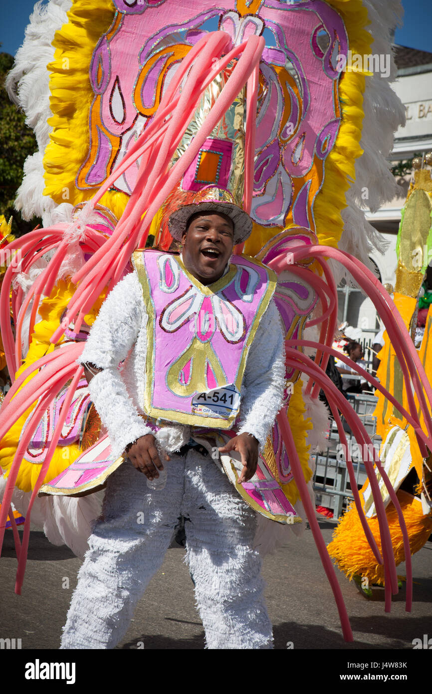 NASSAU, THE BAHAMAS - JANUARY 1 - Male dancer dressed in hugh pink headress, dances in Junkanoo, a traditional island cultural festival in Nassau in J Stock Photo