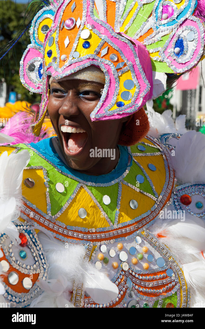 NASSAU, THE BAHAMAS - JANUARY 1 - Smiling female dancer dressed in hugh pink headress, dances in Junkanoo, a traditional island cultural festival in N Stock Photo
