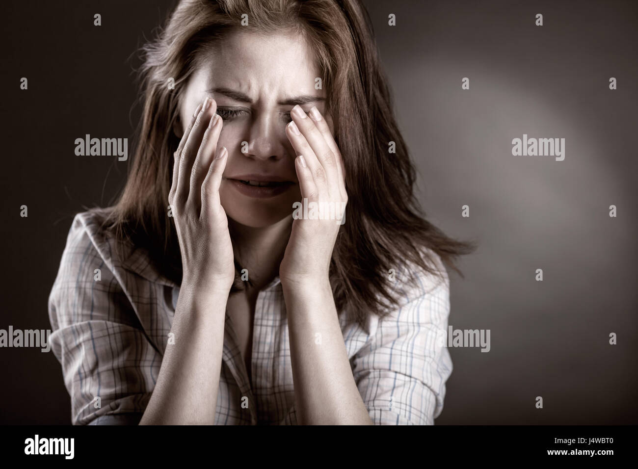 sad woman crying, looking aside on black background, closeup portrait,  profile view Stock Photo - Alamy