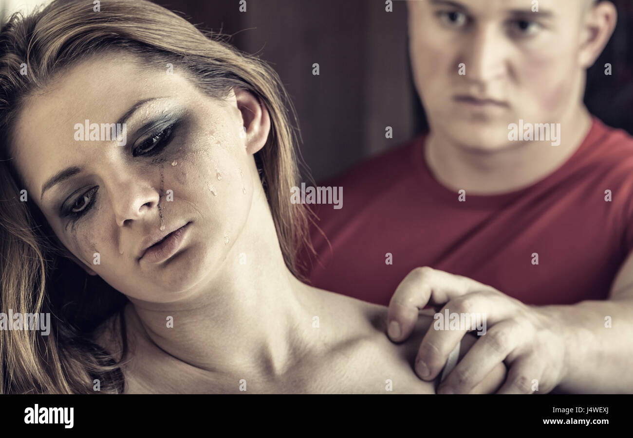 Woman victim of domestic violence and abuse. Tears of a young woman Stock Photo