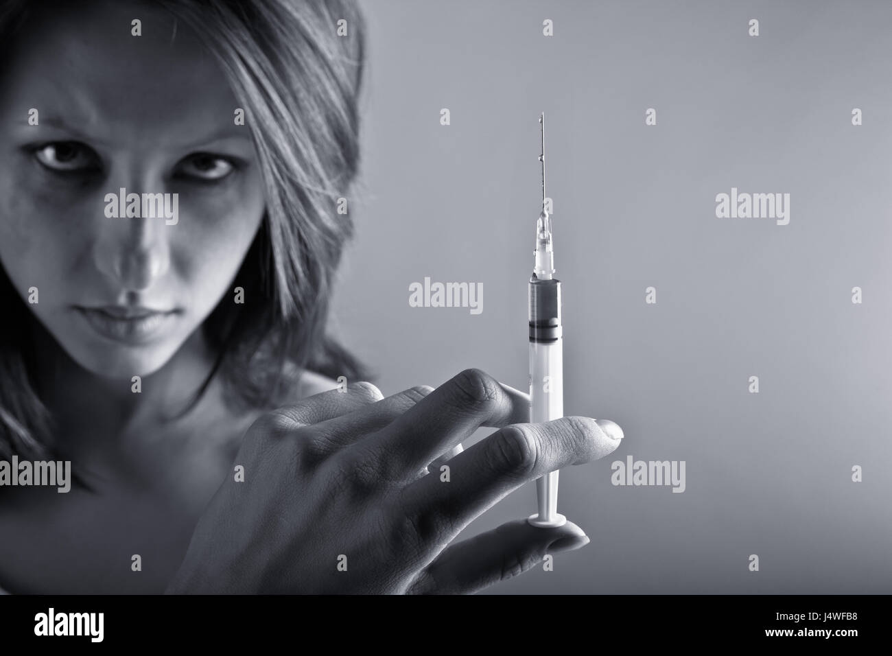 Young woman with drug addiction. Black and white photo Stock Photo