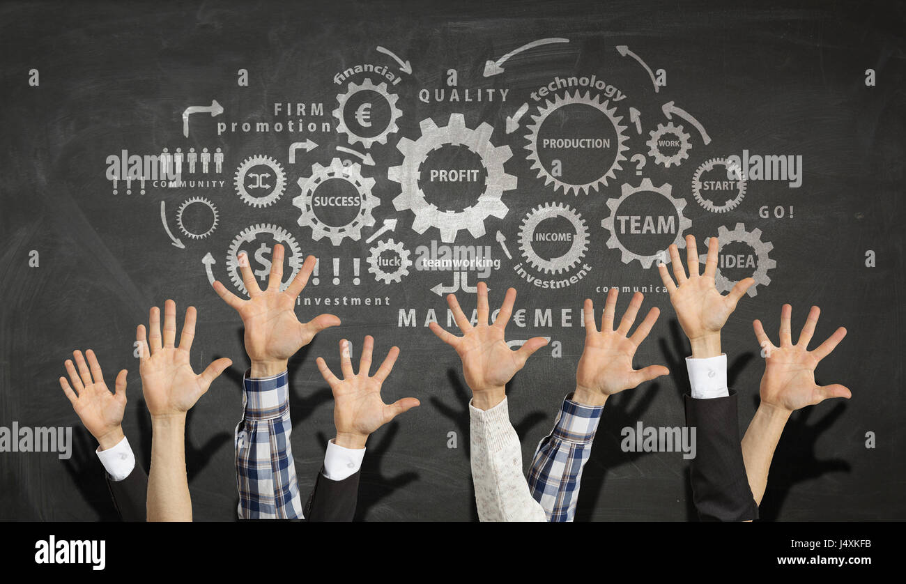 Many people in row raising upward hands showing participation Stock Photo