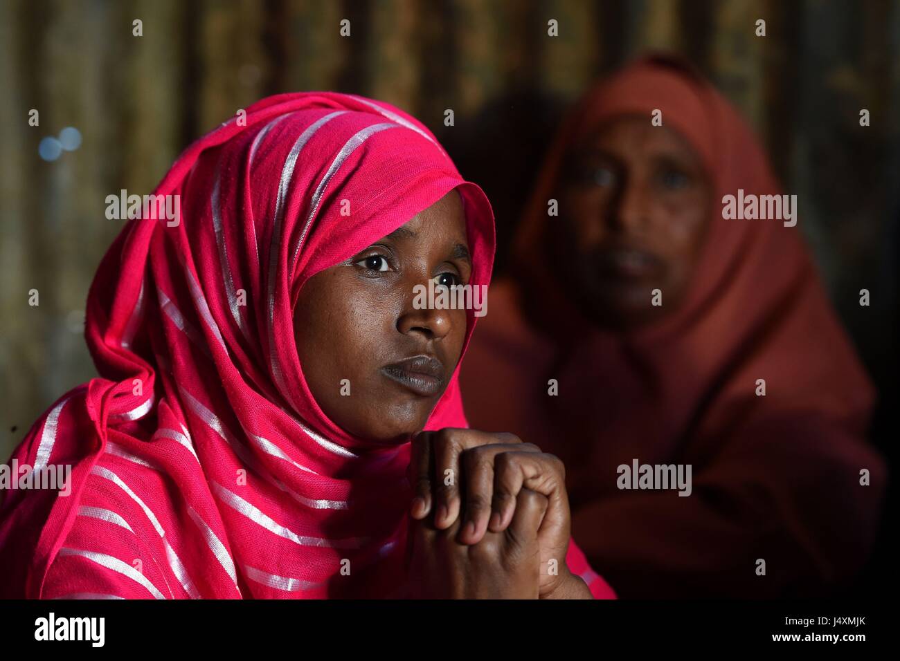 Women are pictured in an internally displaced person (IDP) camp in Hargeisa, Somaliland where families have had to leave their homes in villages move to the city in order to find food and water after recent drought. Stock Photo