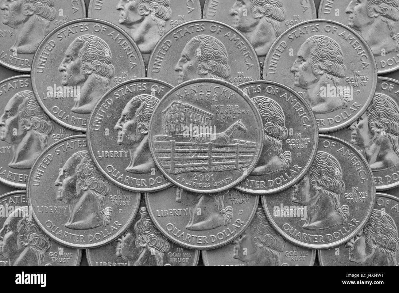 Kentucky State and coins of USA. Pile of the US quarter coins with George Washington and on the top a quarter of Kentucky State. Stock Photo