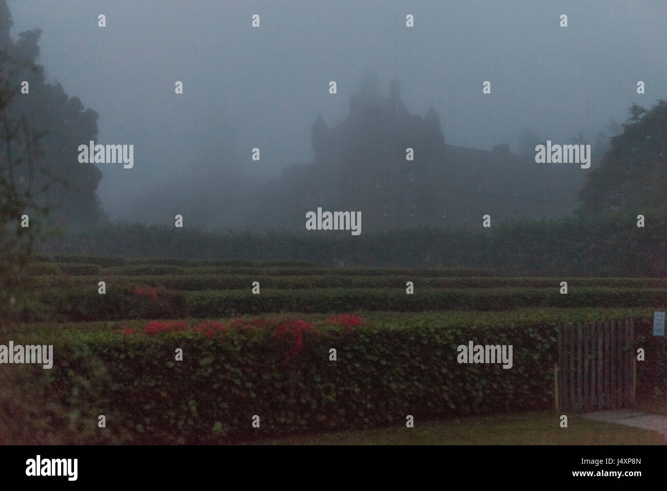 A view of Cawdor Castle in the early morning mist, Nairnshire, Scotland. Derek Hudson / Alamy Stock Photo Stock Photo