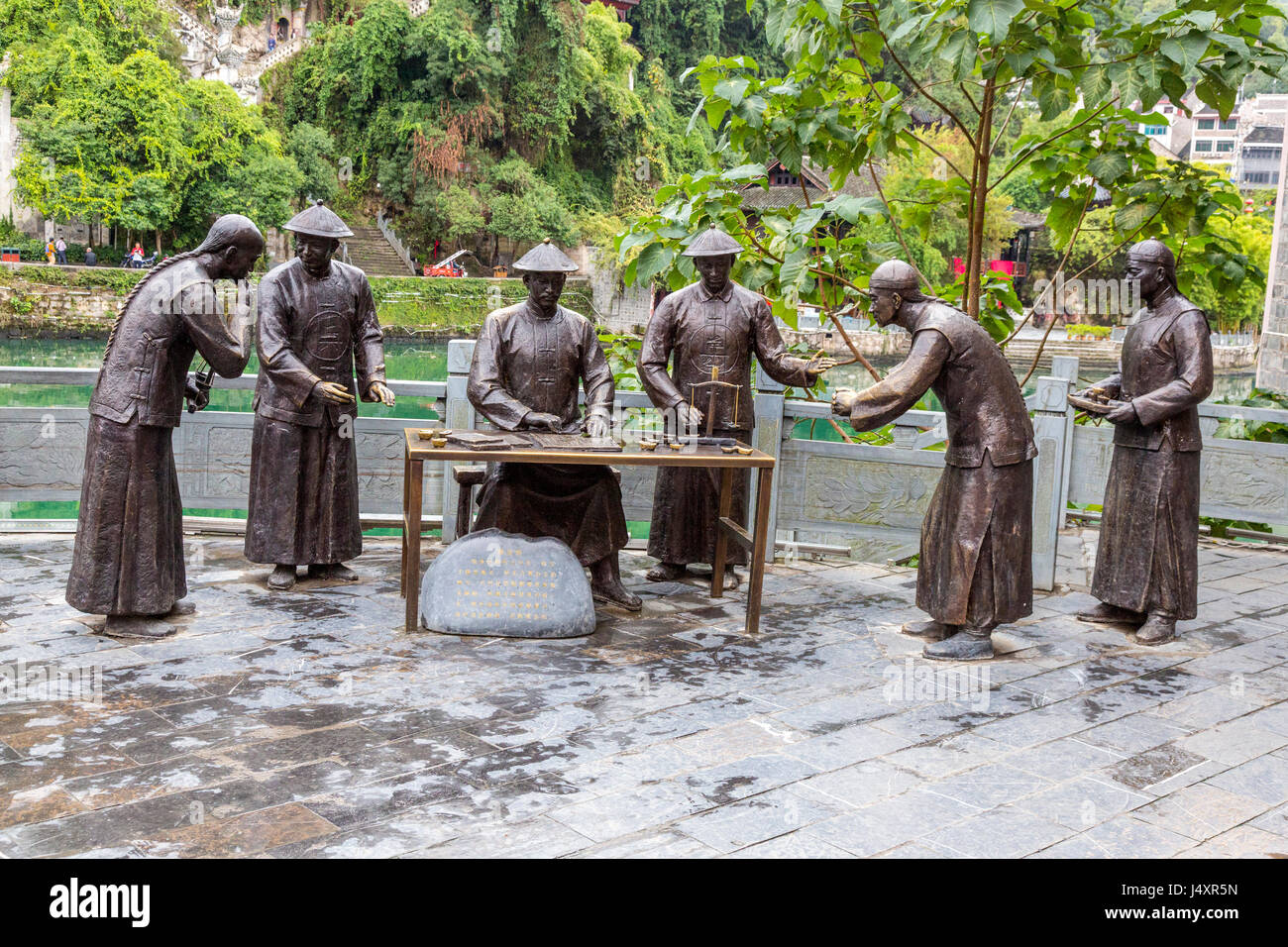 Zhenyuan, Guizhou, China.  Sculpture Depicting Imperial Customs Agents. Stock Photo