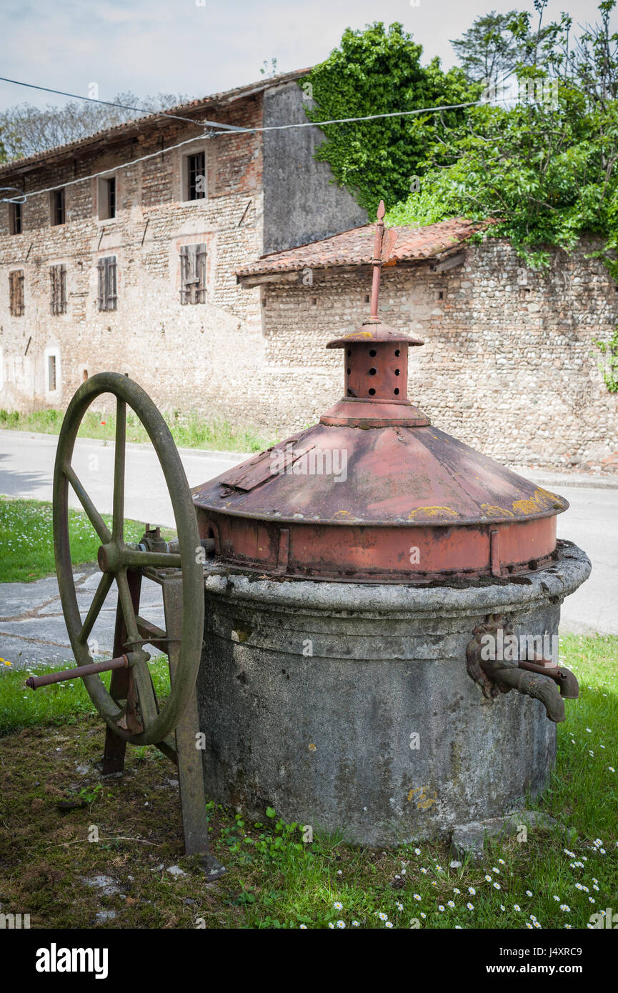 Old well covered with hand pump. It needed around the country. Stock Photo