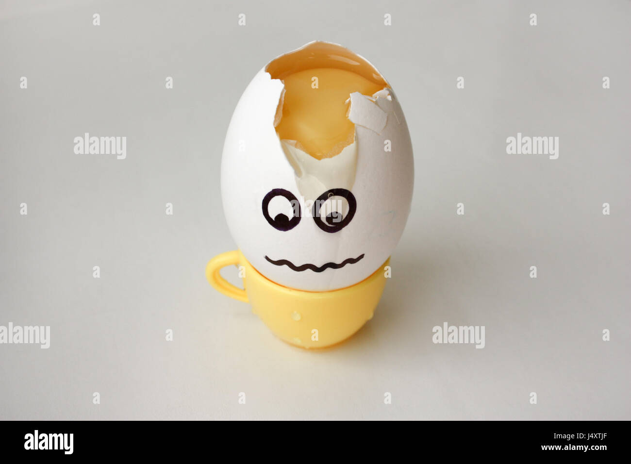 An egg with a face. Funny and sweet. HEADACHE. HEAD IS SHOCKED. Photo