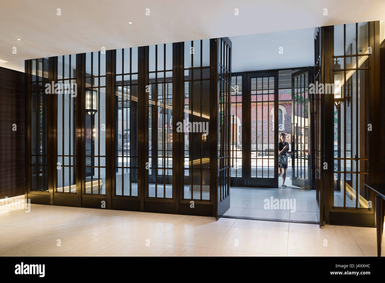 Interior view of the main lobby and entry door. 500 West 21st Street, New York, United States. Architect: Kohn Pedersen Fox Associates (KPF), 2015. Stock Photo