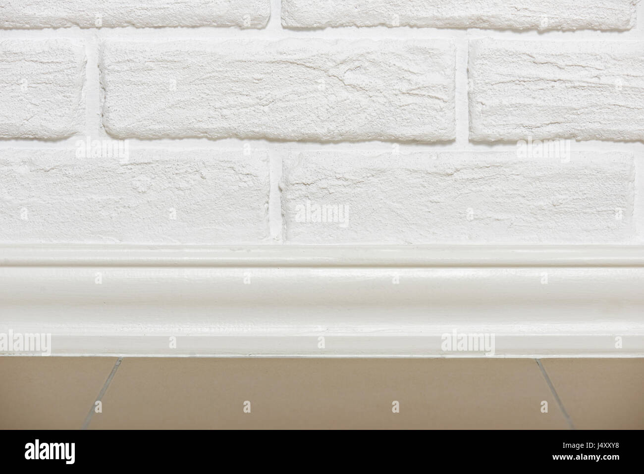white brick wall with tiled floor closeup photo, abstract background ...