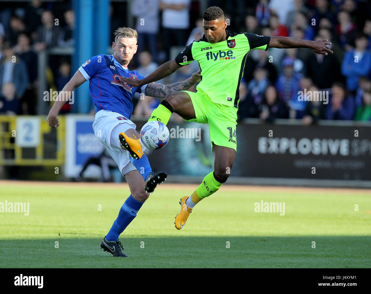 Mike Raynes Carlisle's Michael Raynes (left) and Exeter's Ollie Watkins challenge ...