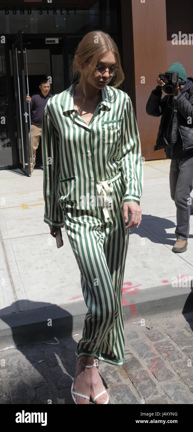 Gigi Hadid leaving her hotel in New York wearing a green and white striped  outfit Featuring: