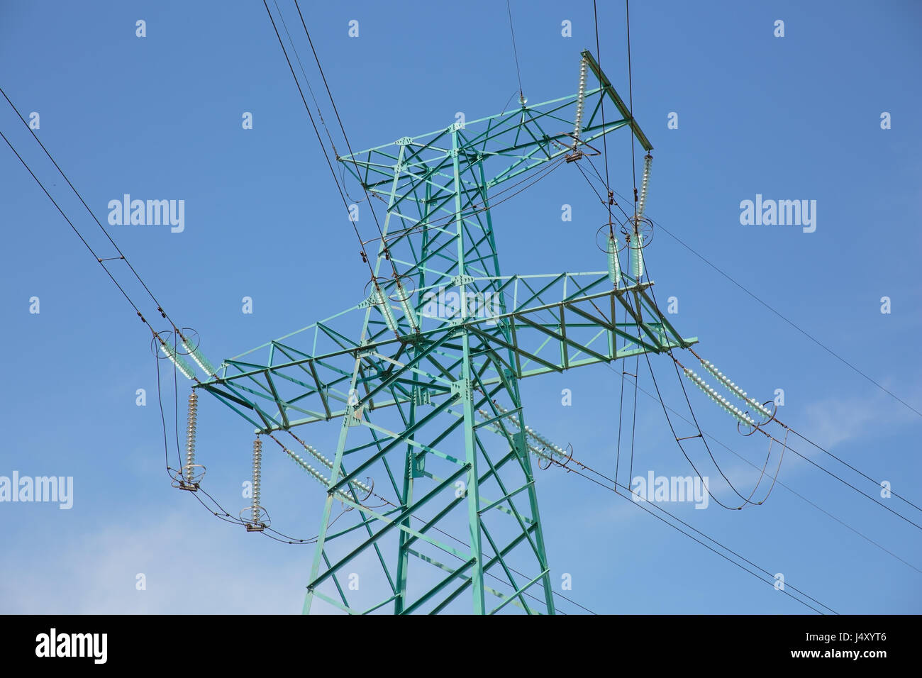 High voltage pylon close to motorway. Power transmission line Stock ...