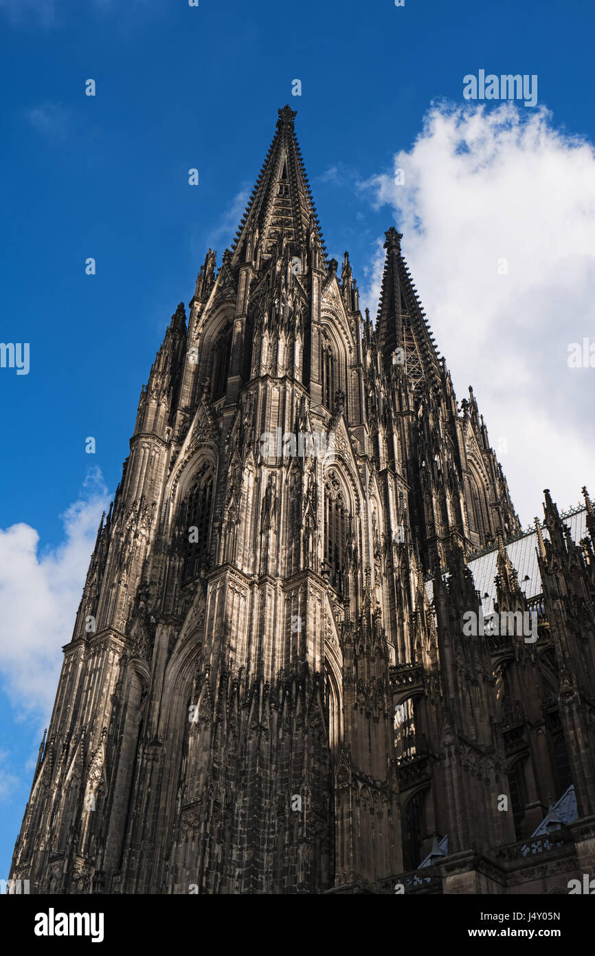Cologne Cathedral on blue sky background, Germany, Europe. Famous monument and most visited place, symbol of Cologne. Beautiful european architecture. Stock Photo