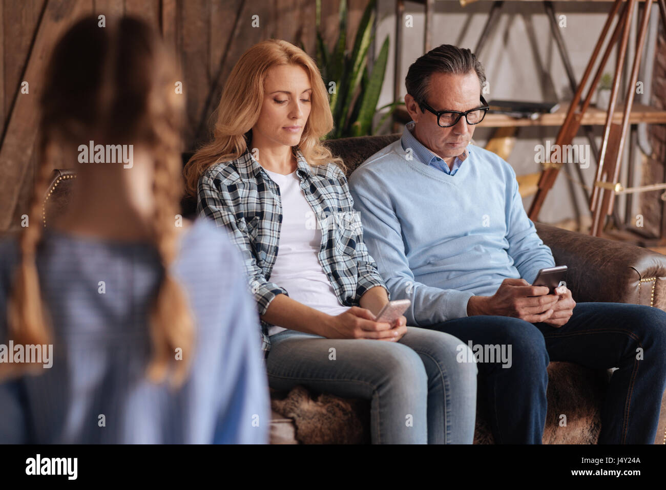 Little girl waiting for parents attention indoors Stock Photo - Alamy