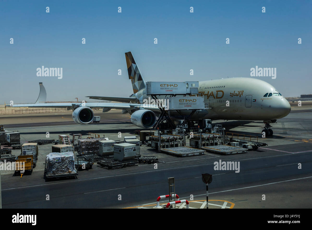 ABU DHABI AIRPORT, ABU DHABI, UAE-17TH AUG 2015:-Airplane being loaded for the flight to Australia Stock Photo