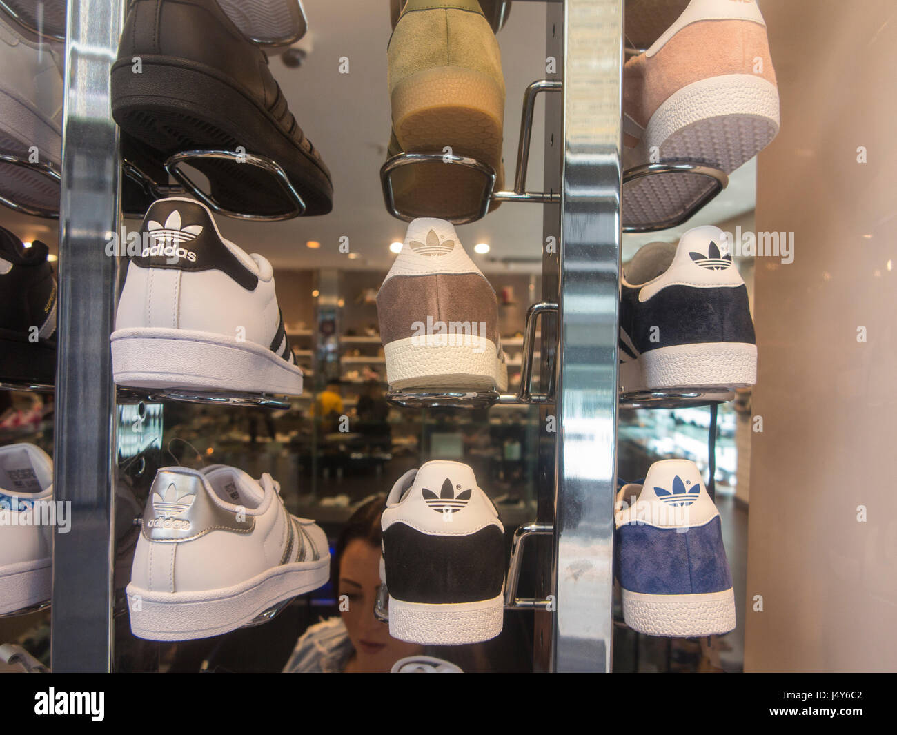 Branded Adidas and Nike trainers in a shoe shop in Soho, London Stock Photo  - Alamy