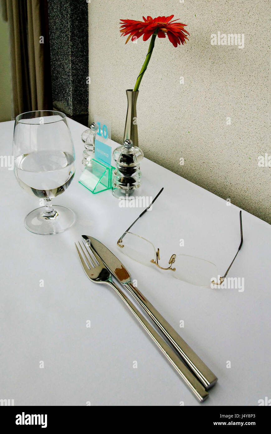 Fine dining place setting with spectacles Stock Photo