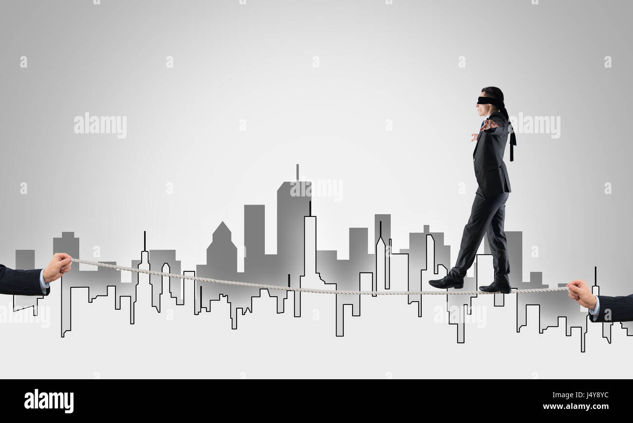 Helping Risk Business concept of risk support and assistance with man balancing on ...