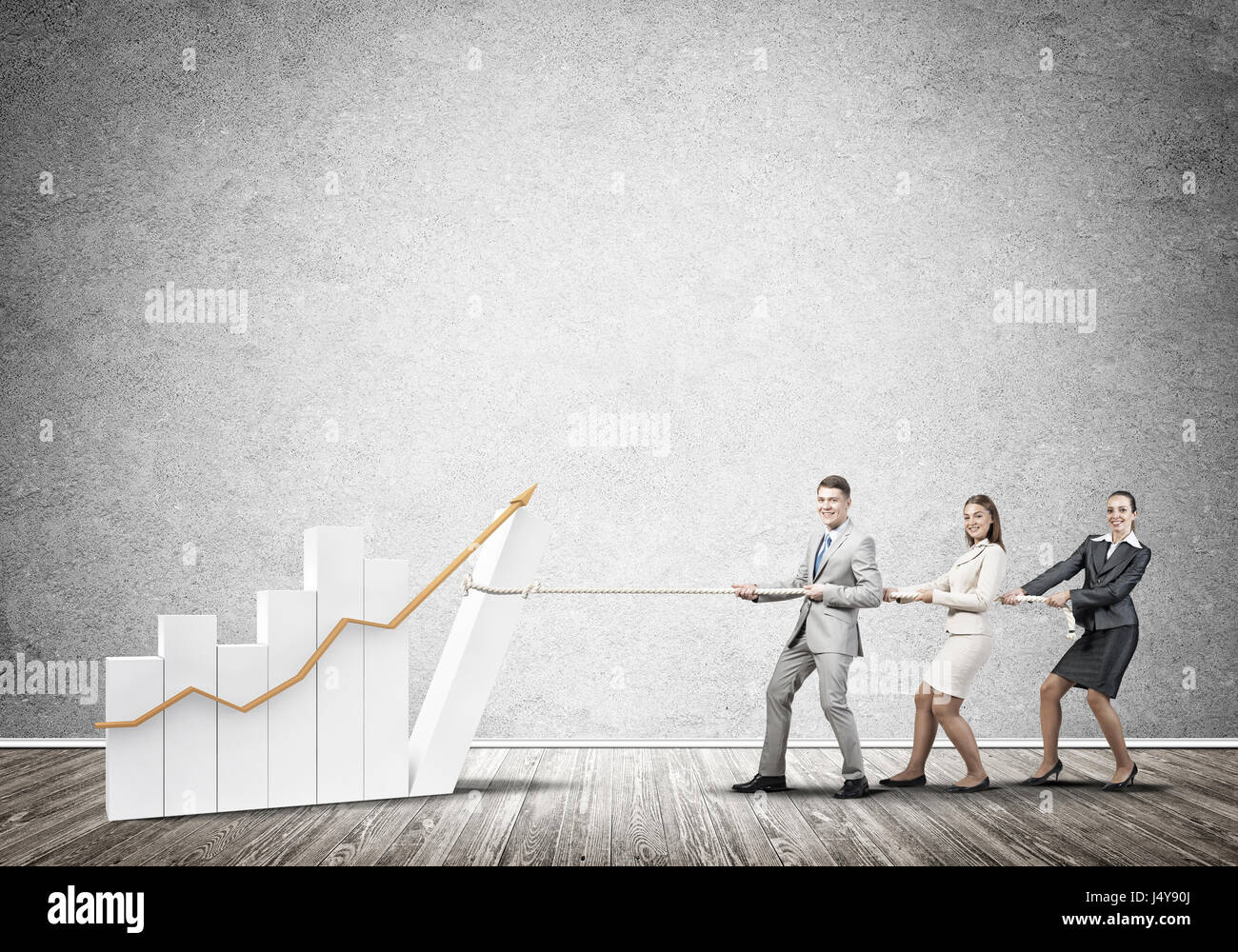 Businessteam working in collaboration pulling graph with rope as symbol ...