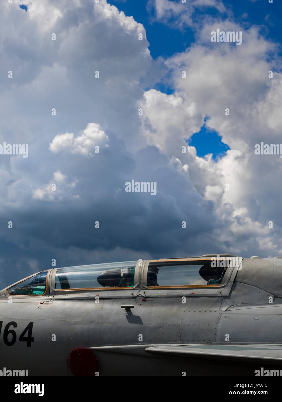 MiG-21 two-seater and sunshine cloudy sky Stock Photo