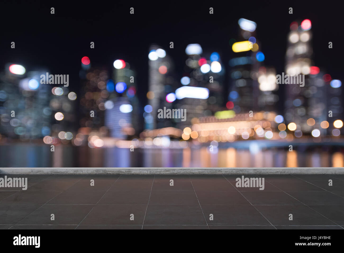 Black Tile floor in front of blur bokeh building city night life background  for mockup advertising decoration design ready for your product display  Stock Photo - Alamy