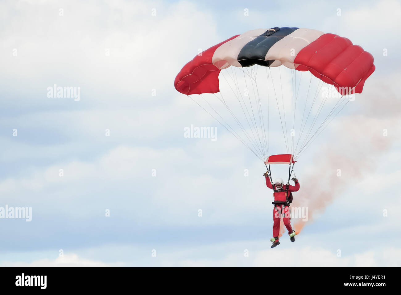 Member of the British Army's Red Devils freefall parachute display team coming into land at the Farnborough Airshow, UK on July 24, 2010 Stock Photo