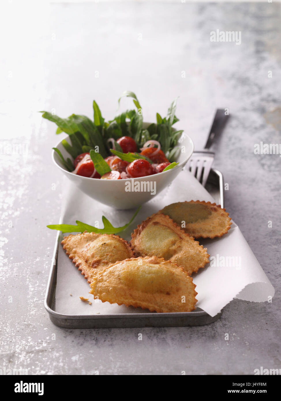 Deep fried panzerotti with rocket salad Stock Photo Alamy