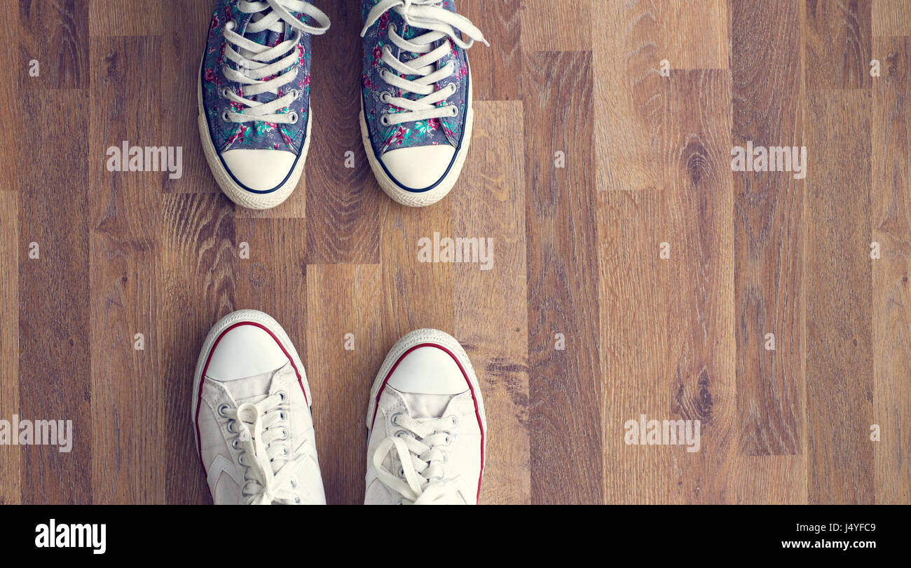 sneakers on wooden floor background Stock Photo - Alamy