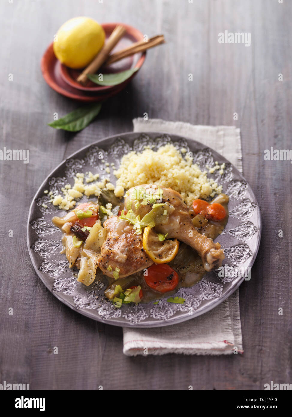 Lemon chicken with couscous Stock Photo Alamy