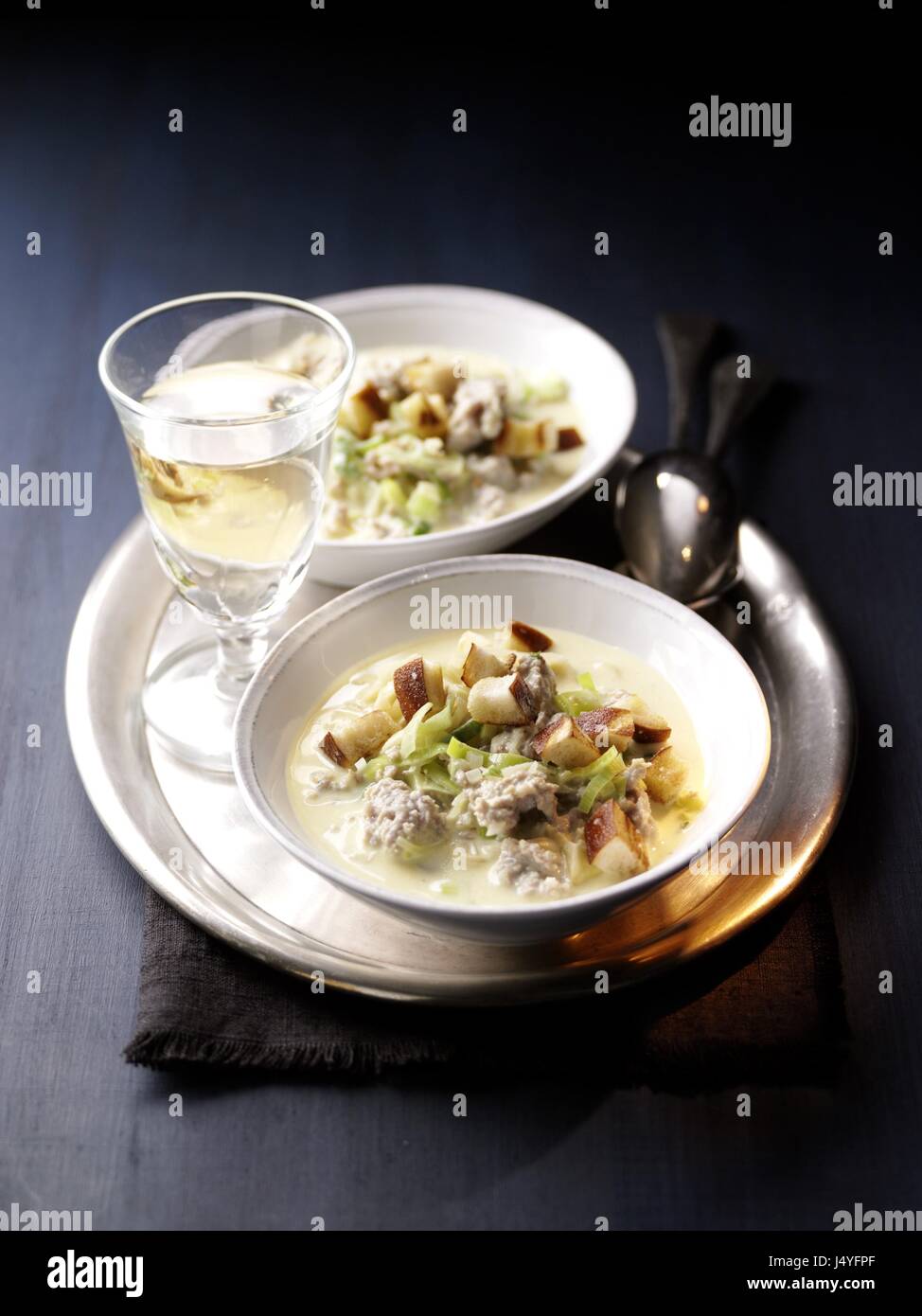 Cheese soup with german minced pork meat and pretzel croutons Stock Photo