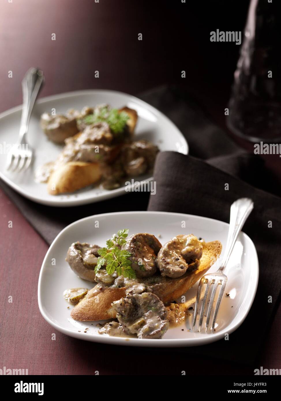Lamb kidneys in mustard sauce on roasted baguette Stock Photo Alamy