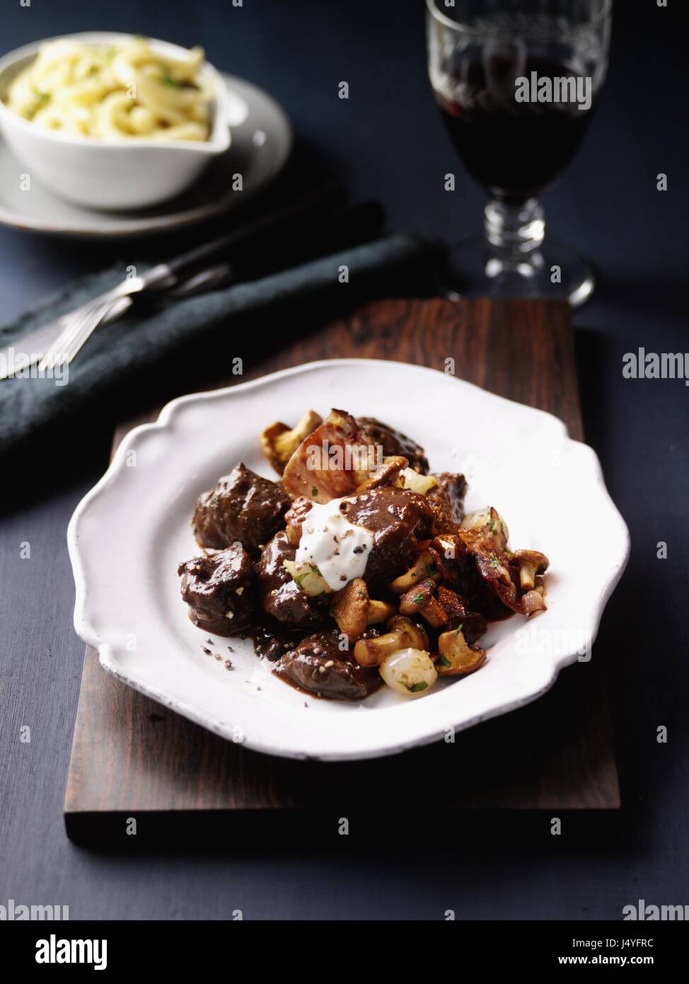 Venison goulash with chanterelles Stock Photo Alamy